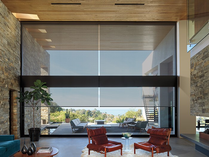 Large living room with large windows with designer screen shades, Fabric: New Orleans.